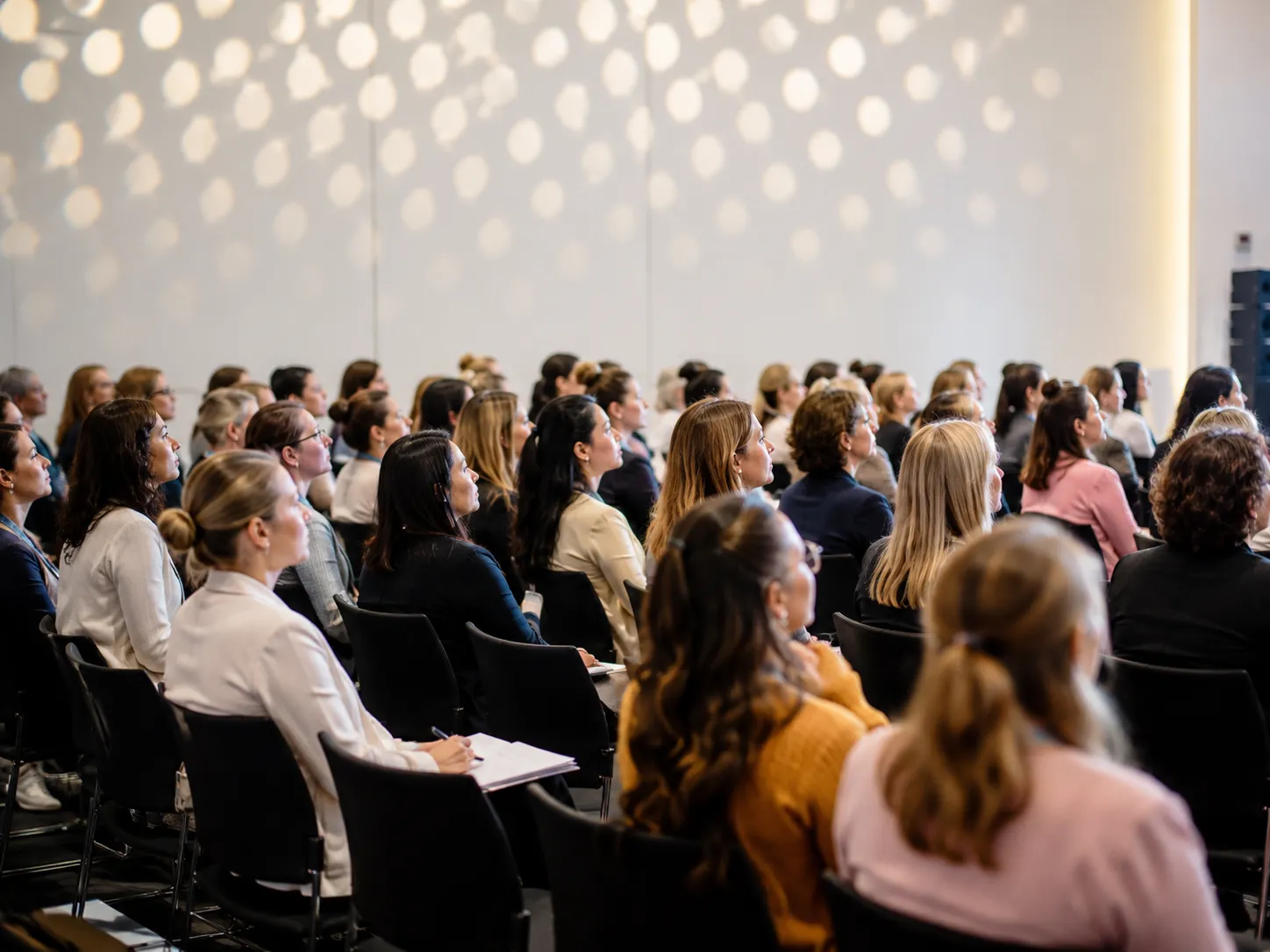 People listening at a leadership event